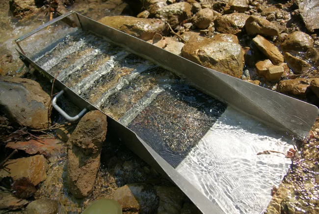 Sluice box for gold mining. Image: CC